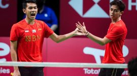 Indonesia's Fajar Alfian and Muhammas Rian Ardianto (R) react after winning a point during their men's s double match against China's He Ji Ting and Zhou Hao Dong (Both unseen) during the Thomas Cup men's team final match between China and Indonesia in Aarhus, Denmark, on October 17, 2021. (Photo by Claus Fisker / Ritzau Scanpix / AFP) / Denmark OUT