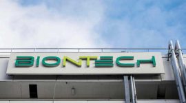 (FILES) In this file photo taken on March 27, 2021 the logo on the facade of the new manufacturing site of German company BioNTech for the production of the Covid-19 vaccine is seen in Marburg, central Germany. - Covid jab maker BioNTech said on Mai 10, 2021 it would build a Southeast Asia headquarters and manufacturing site in Singapore to produce hundreds of millions of mRNA-based vaccines per year, with construction of the site starting this year to become operational by 2023. (Photo by Thomas Lohnes / AFP)
